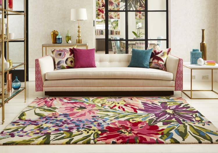 Vibrant floral Floreale Rug Fuchsia in modern living room setting.