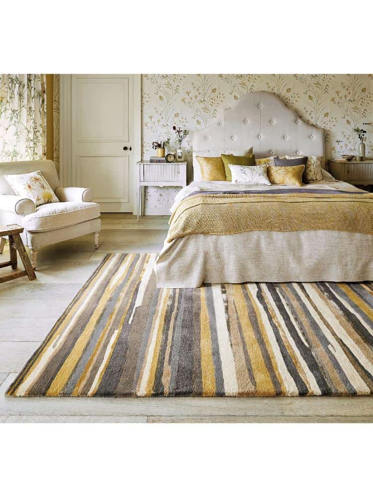Elsdon Rug Linden in a stylish bedroom with vintage decor and soft lighting.