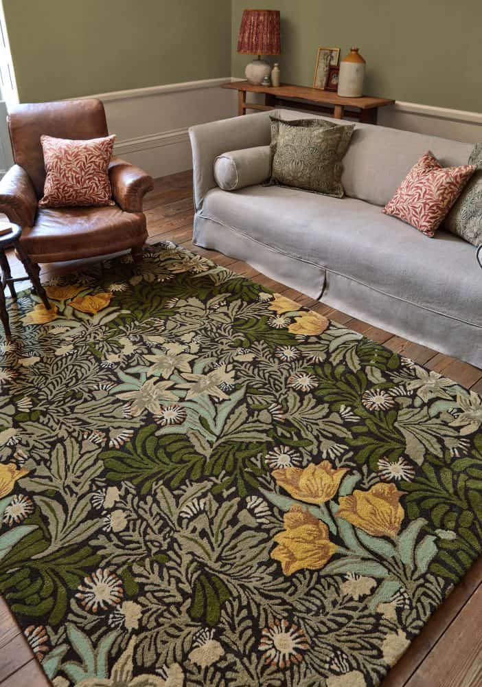 Elegant living room with Twining Vine Green rug and vintage furniture.