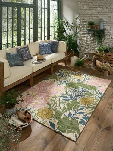 Colourful floral outdoor rug with green, pink, blue, and yellow patterns.