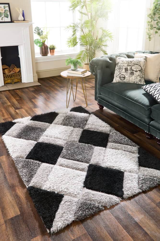 Geo 3D Shaggy Rug Grey in stylish living room setting.