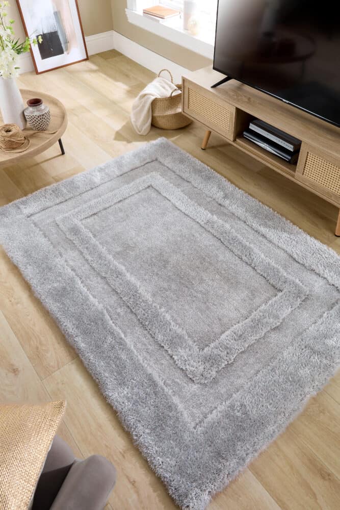 Soft textured shaggy silver rug in modern living room setting.