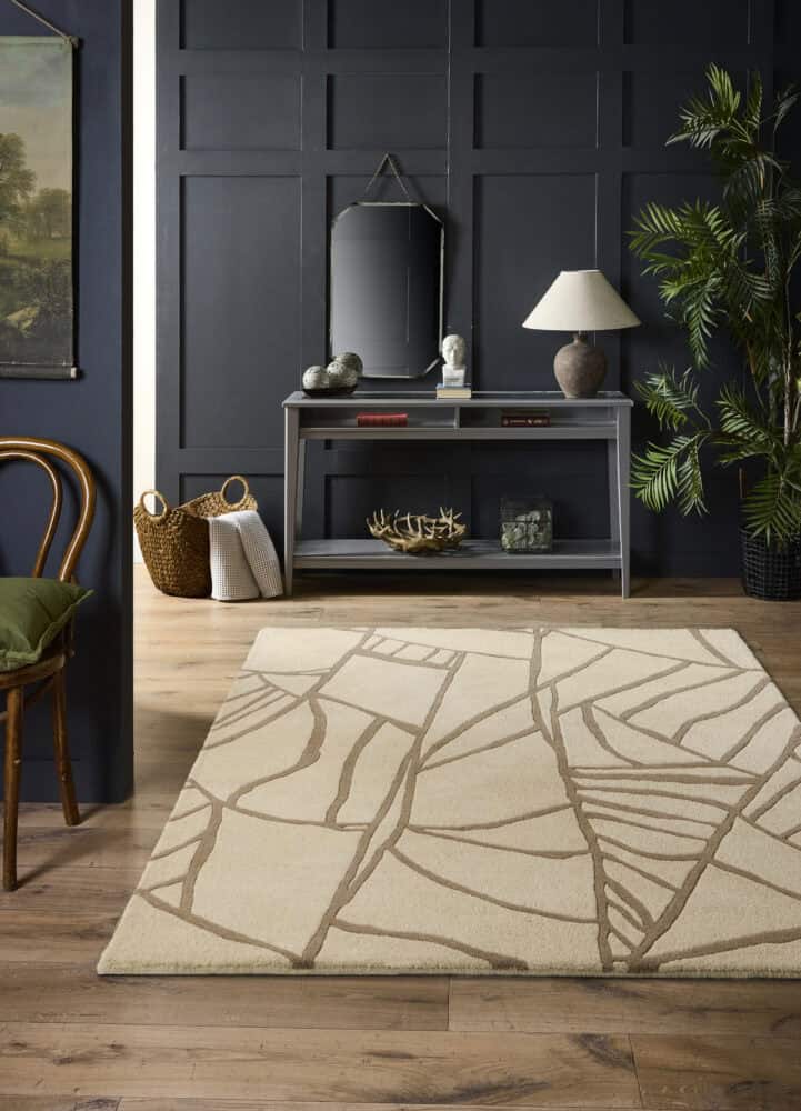 Cream Kintsugi rug with abstract branch design in living room.
