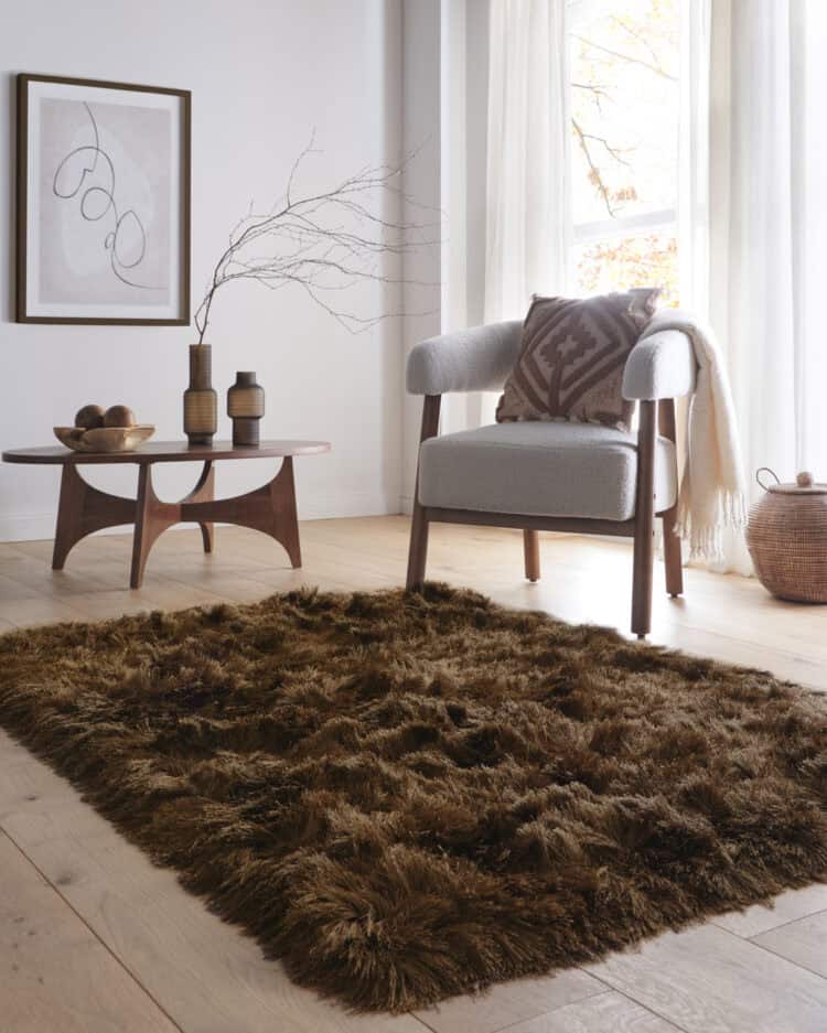 Glamour Deluxe Rug Mocha with soft shaggy texture in a modern living room.
