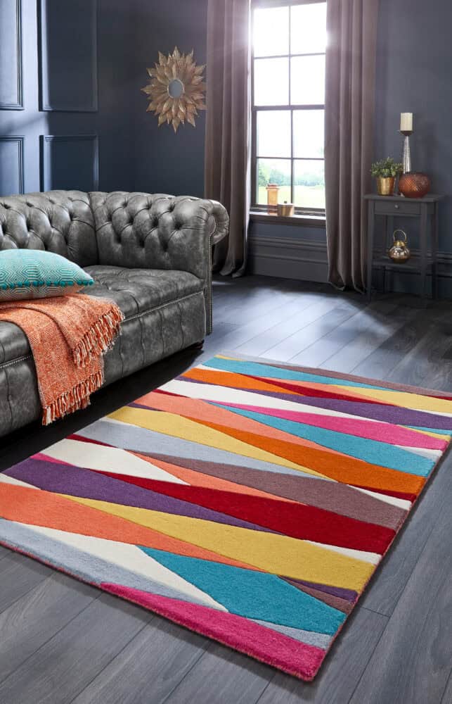 Vibrant multi-coloured striped rug in modern living room setting.