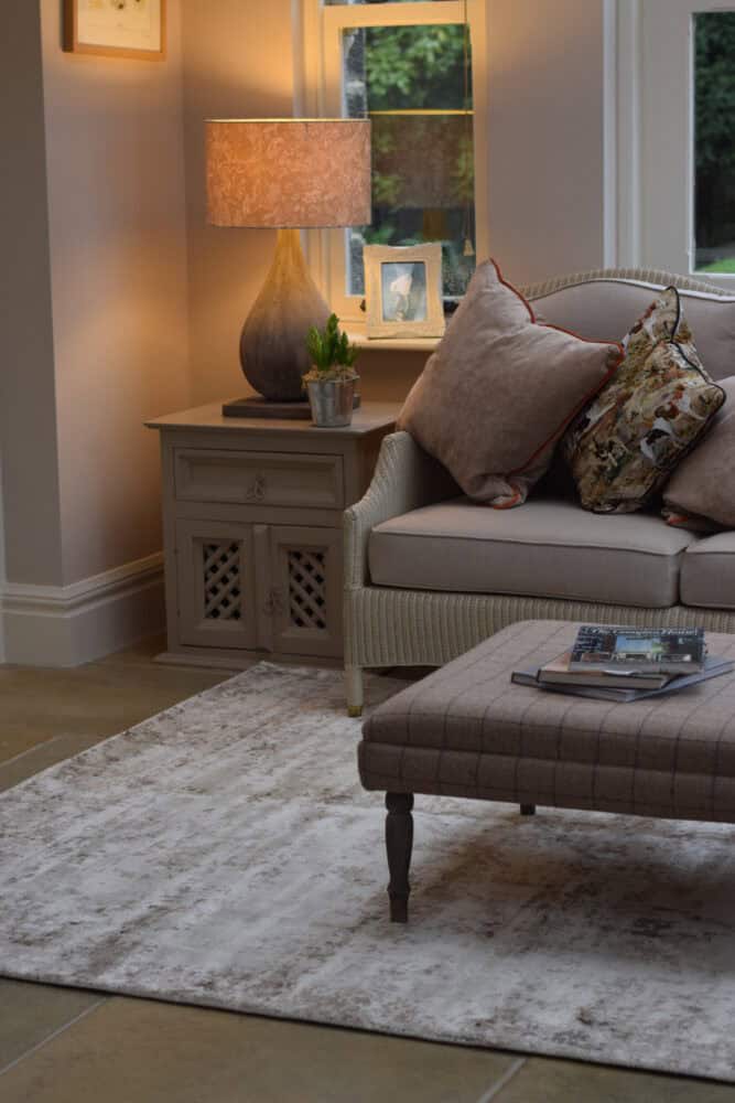 Elegant living room with Persia Rug Mocha Cloud and cozy cushions.