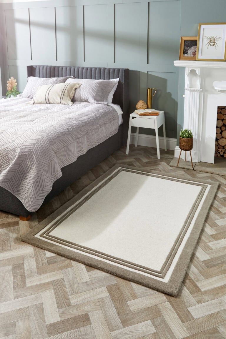 Taupe and cream rug in a contemporary bedroom setting.