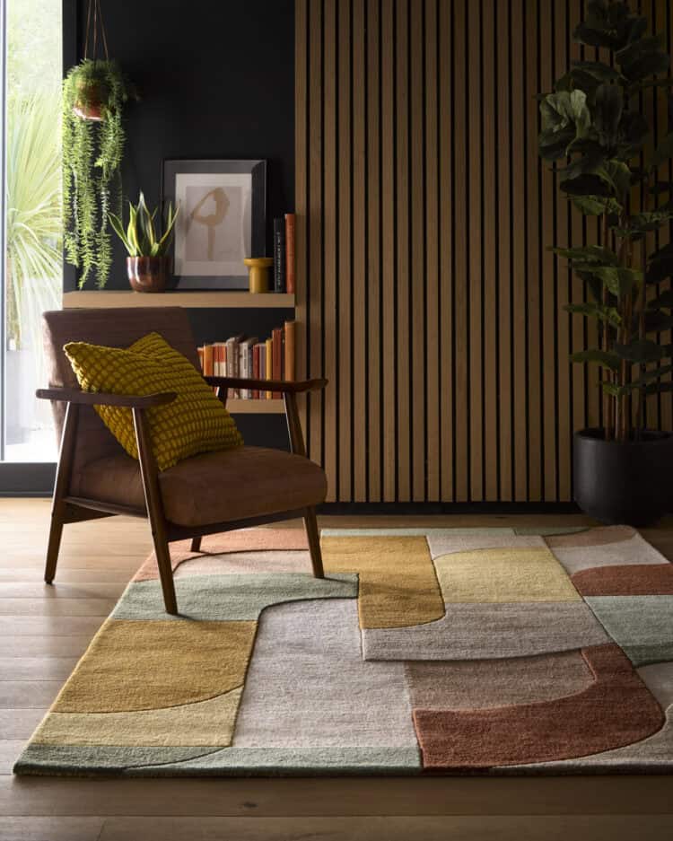 Retro deco rug in tan with geometric patterns in a stylish living room.