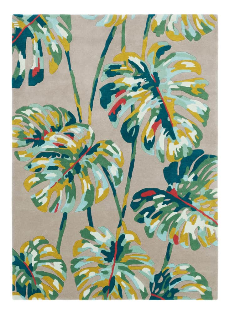 Vibrant tropical leaf patterned rug with green, yellow, and red accents.